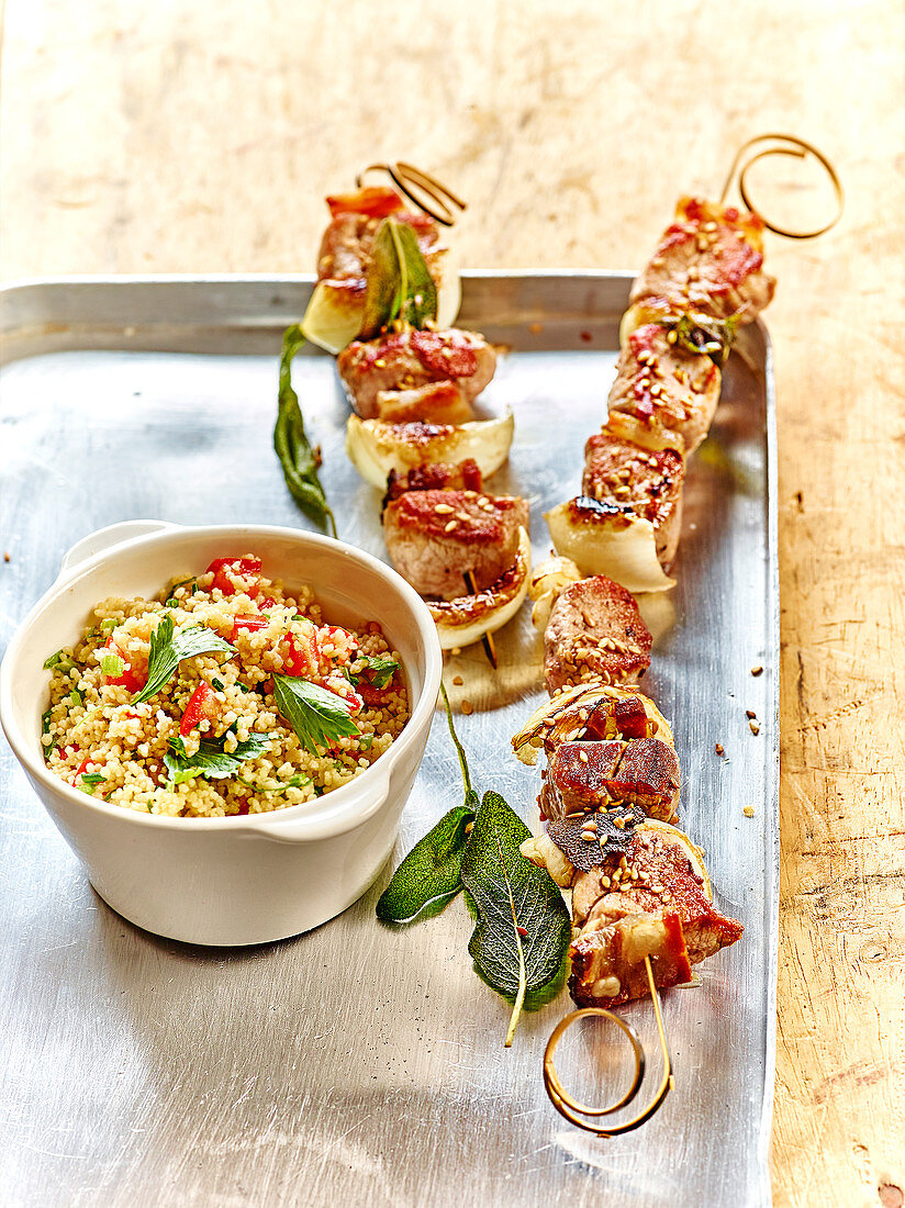 Pork and onion skewers with sesame seeds, mint tabbouleh