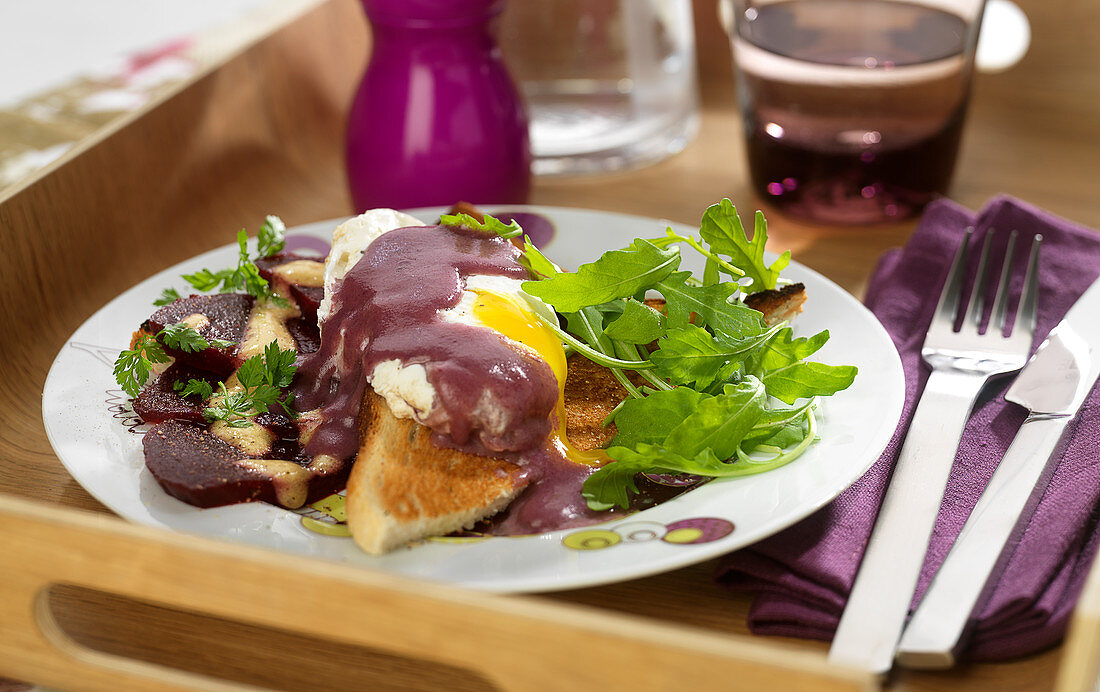 Toasted White Bread Topped With A Poached Egg,Red Wine And Shallot Sauce,Rocket Lettuce And Beetroot