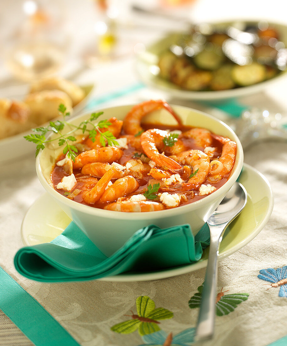 Shrimps flambeed in Cognac with tomato sauce and feta crumbs