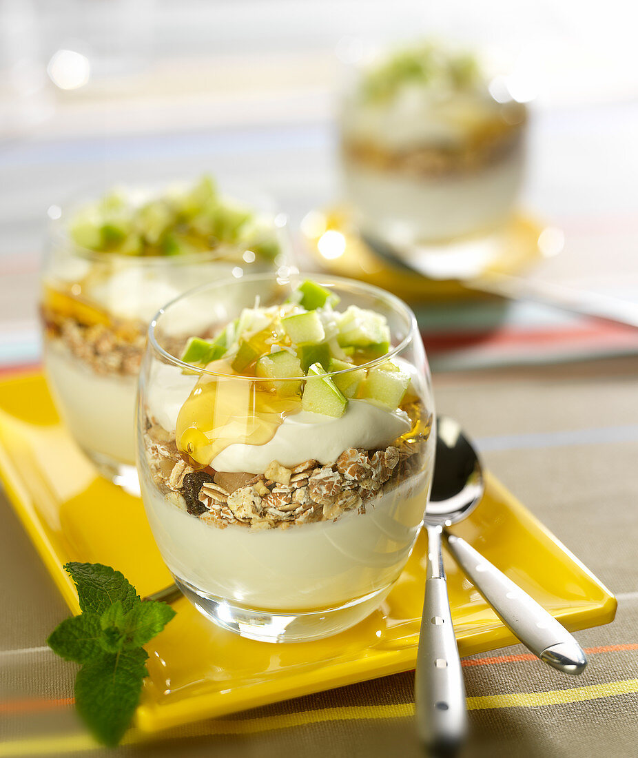 Greek yoghurt, muesli, diced apple, honey and walnut pudding topped with grated coconut