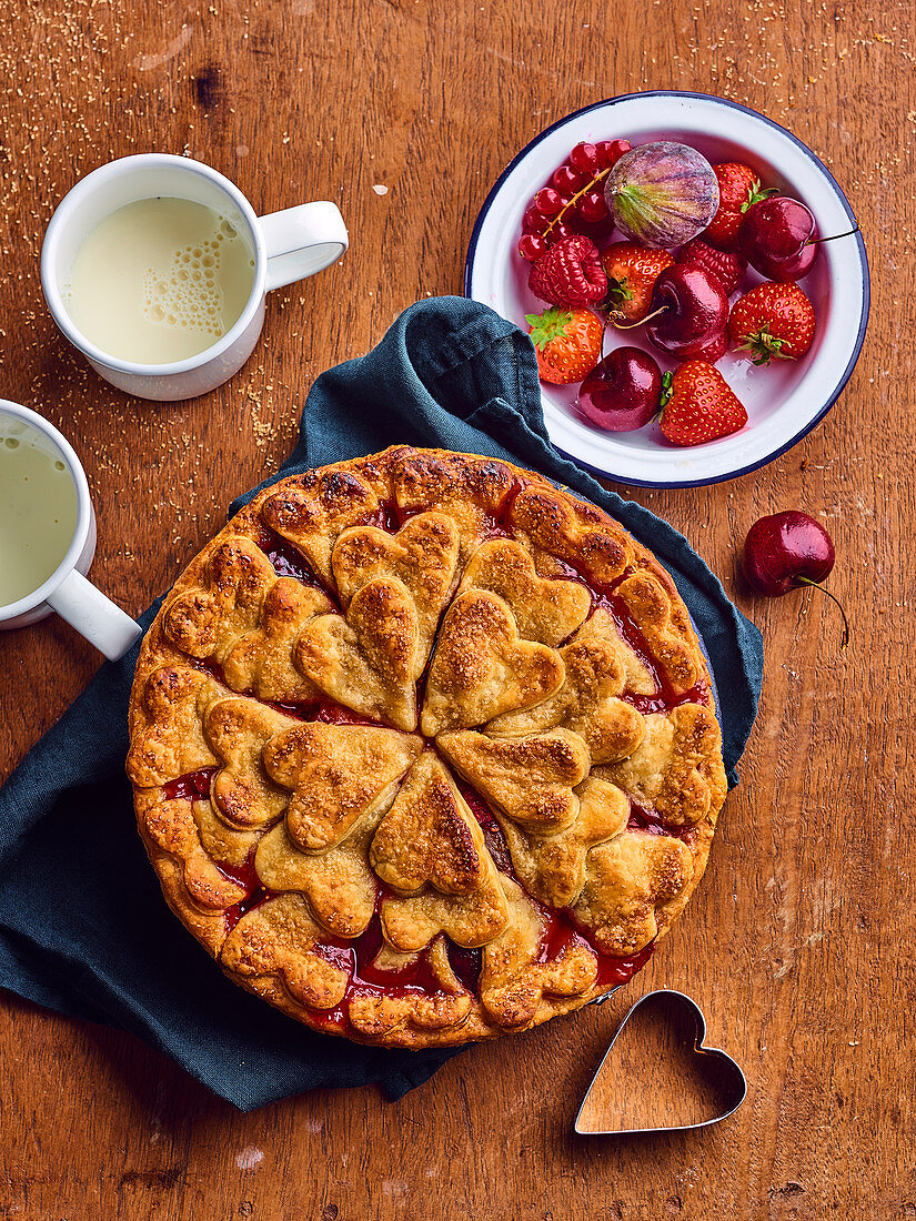 Summer fruit pie decorated with pastry hearts