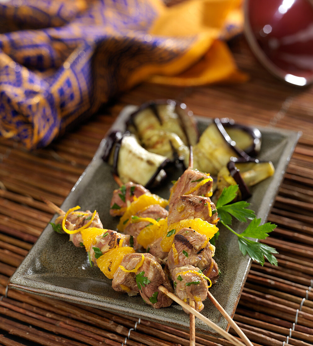 Lamb and orange brochettes with grilled aubergines