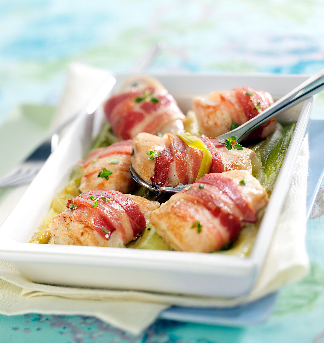 Chicken bites wrapped in bacon with leeks