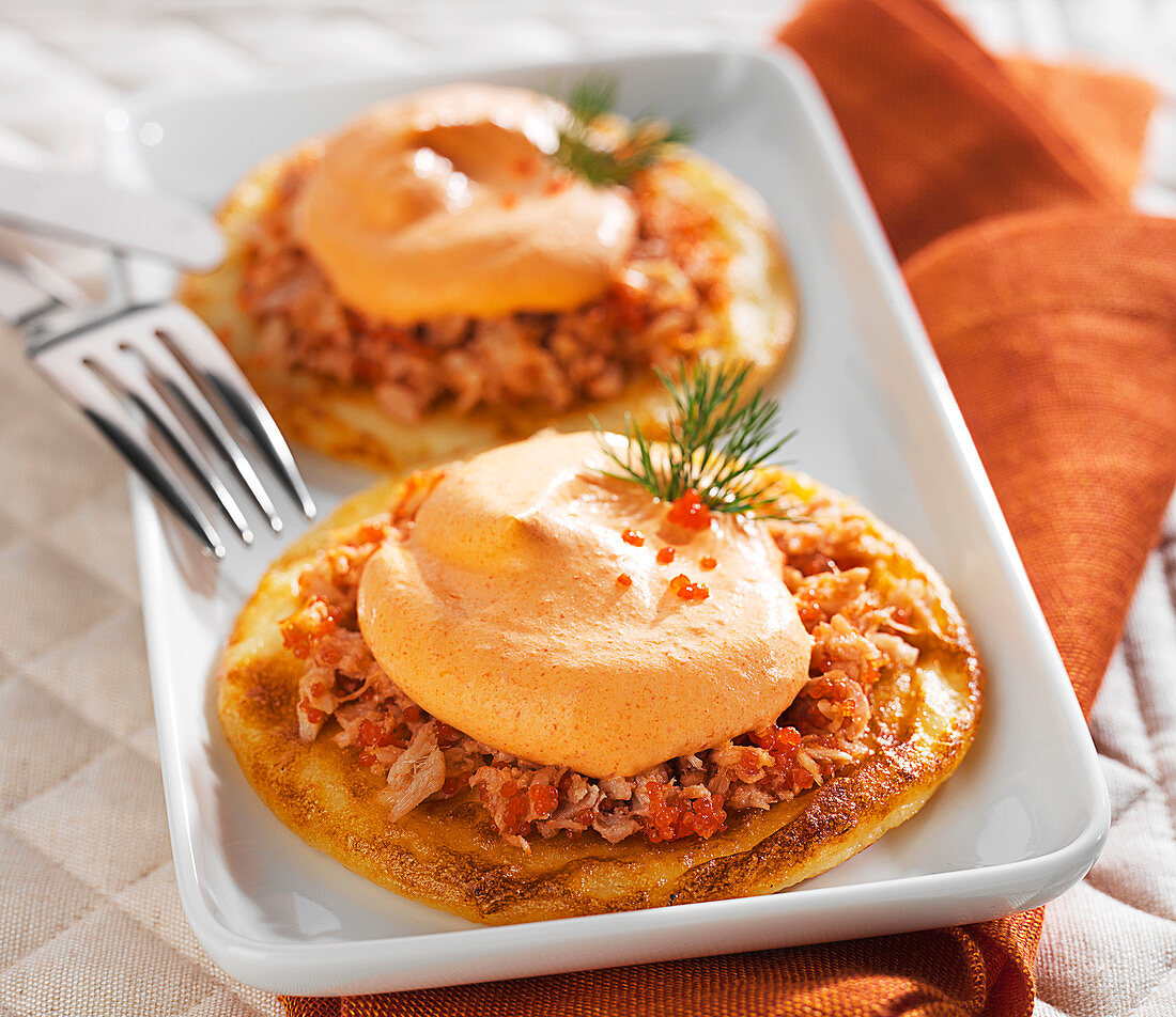 Potato pancakes with tuna and red pepper whipped cream