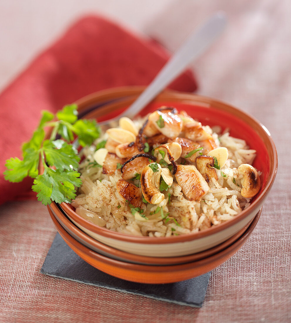 Pilaf rice with chicken,cashes, almond and spices