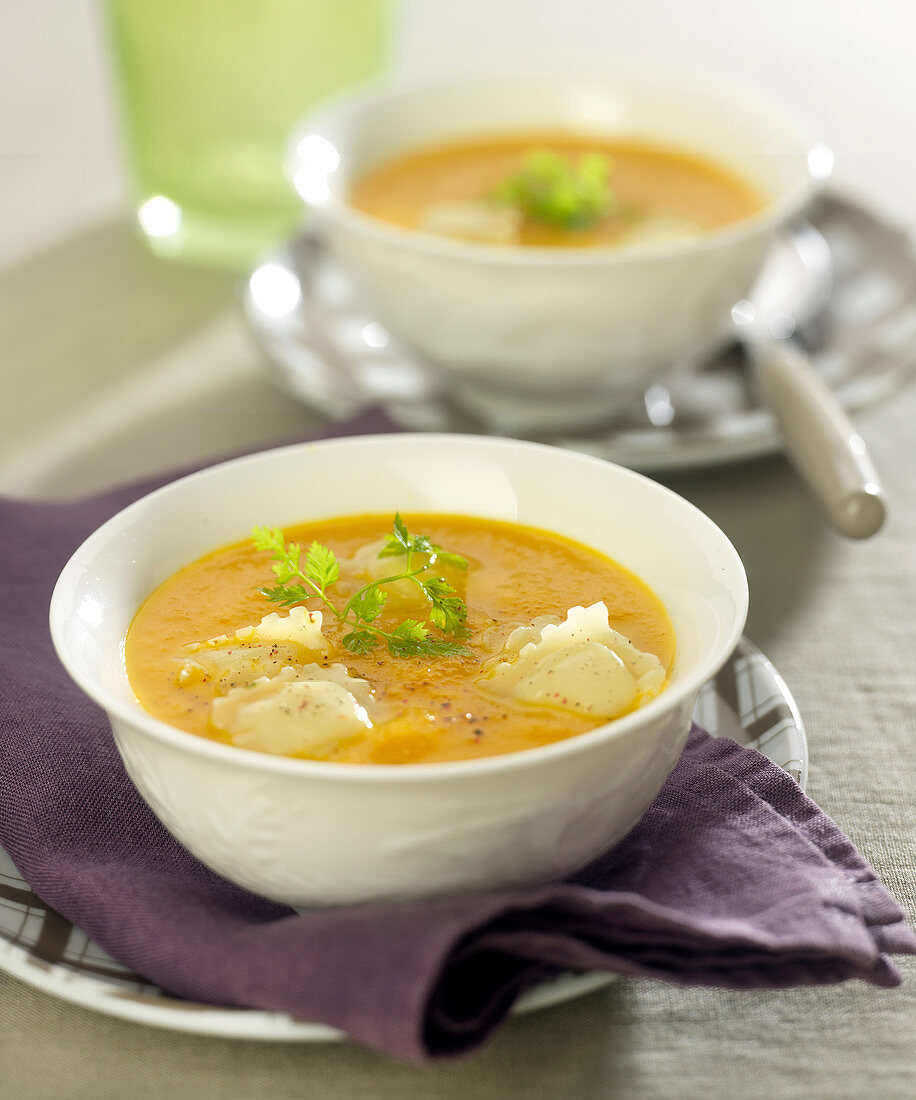 Cream of carrot soup with raviolis