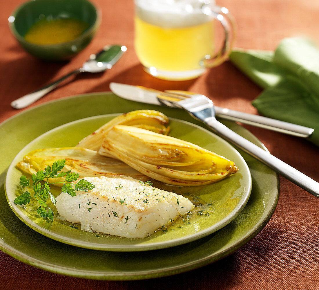 Piece of cod with chicory braised in beer and thyme