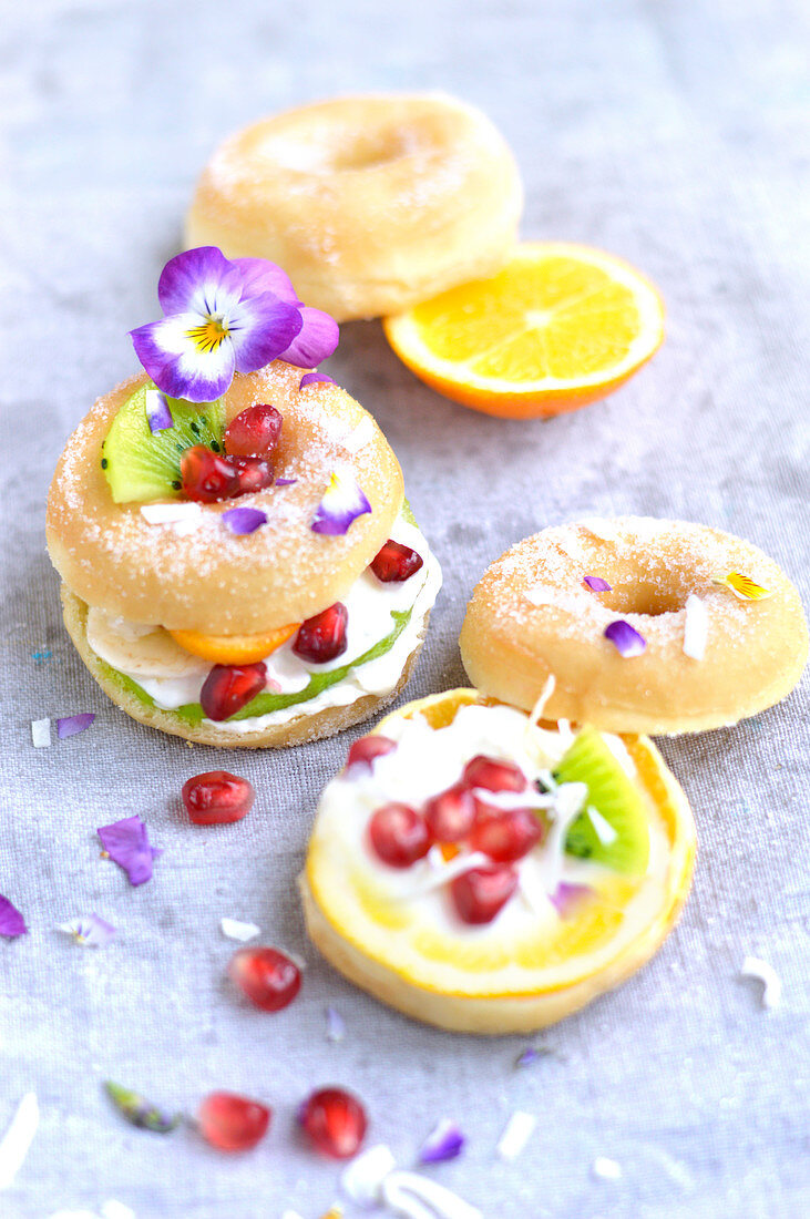 Small donuts with cream and fresh fruit