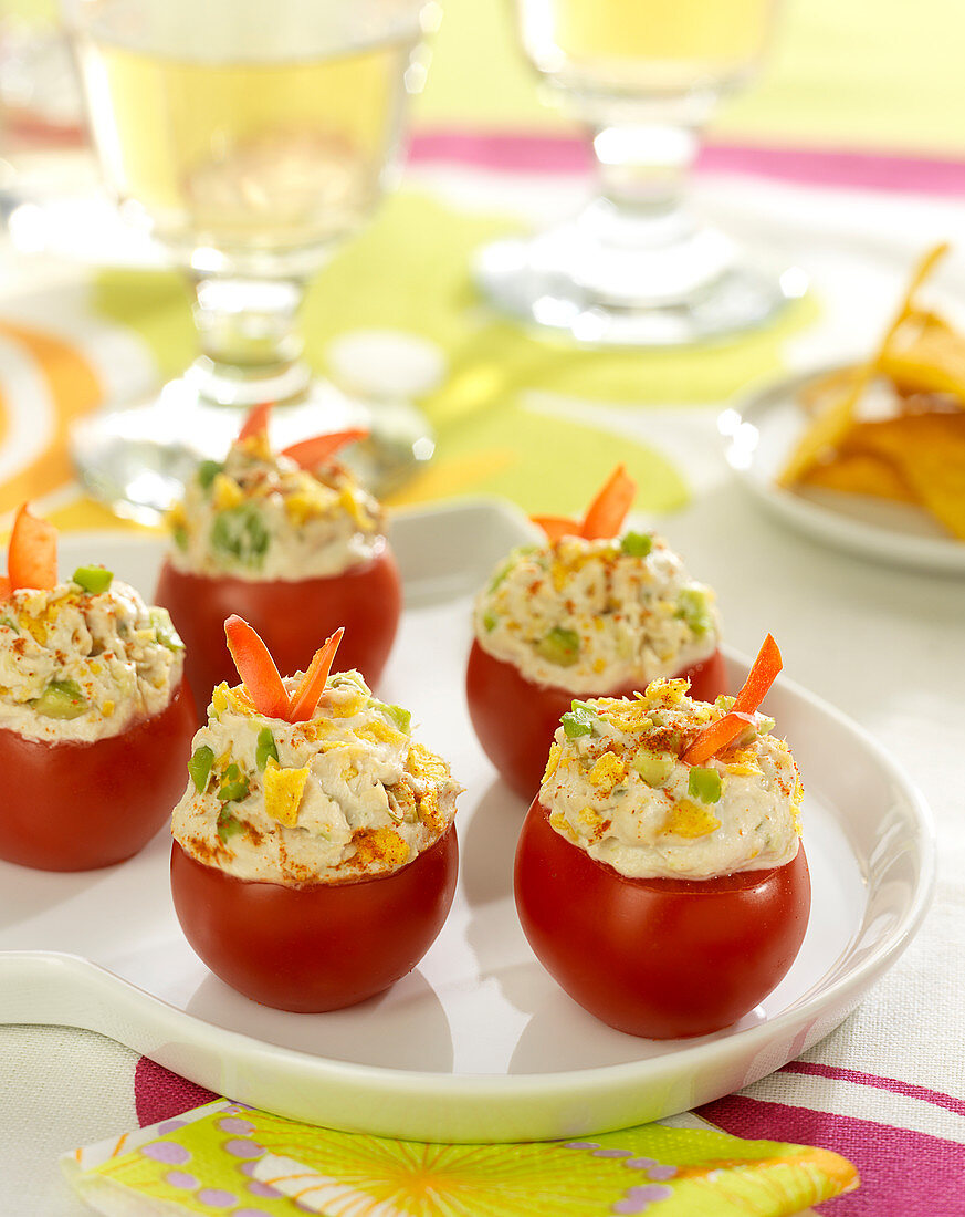 Tomatoes stuffed with fromage frais, tuna, tortillas and avocado