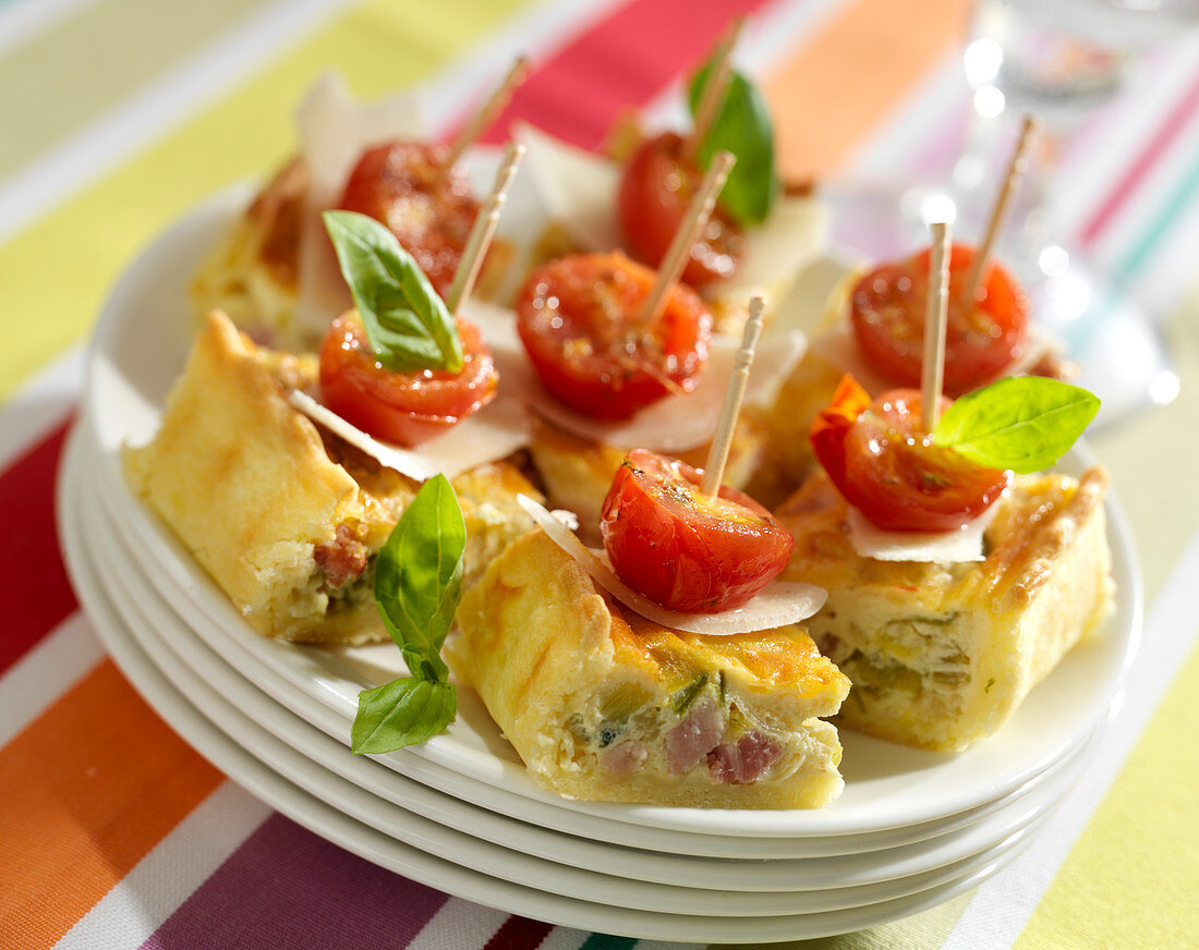 Country quiche, parmesan flake,cherry tomato and basil appetizers
