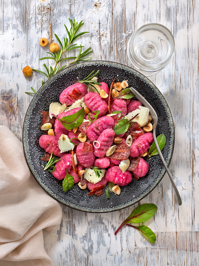 Beetroot gnocchis with rosemary, crisp bacon, goat's cheese and hazelnut