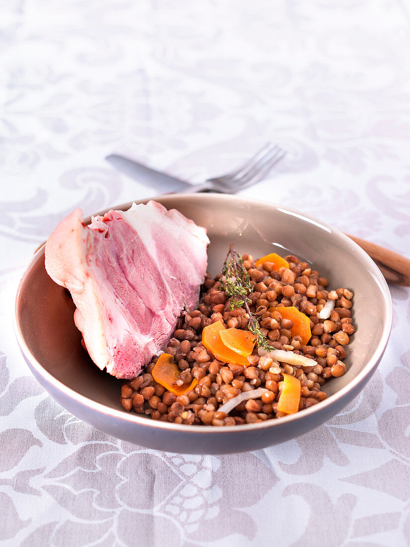 Piece of knuckle of pork with lentils