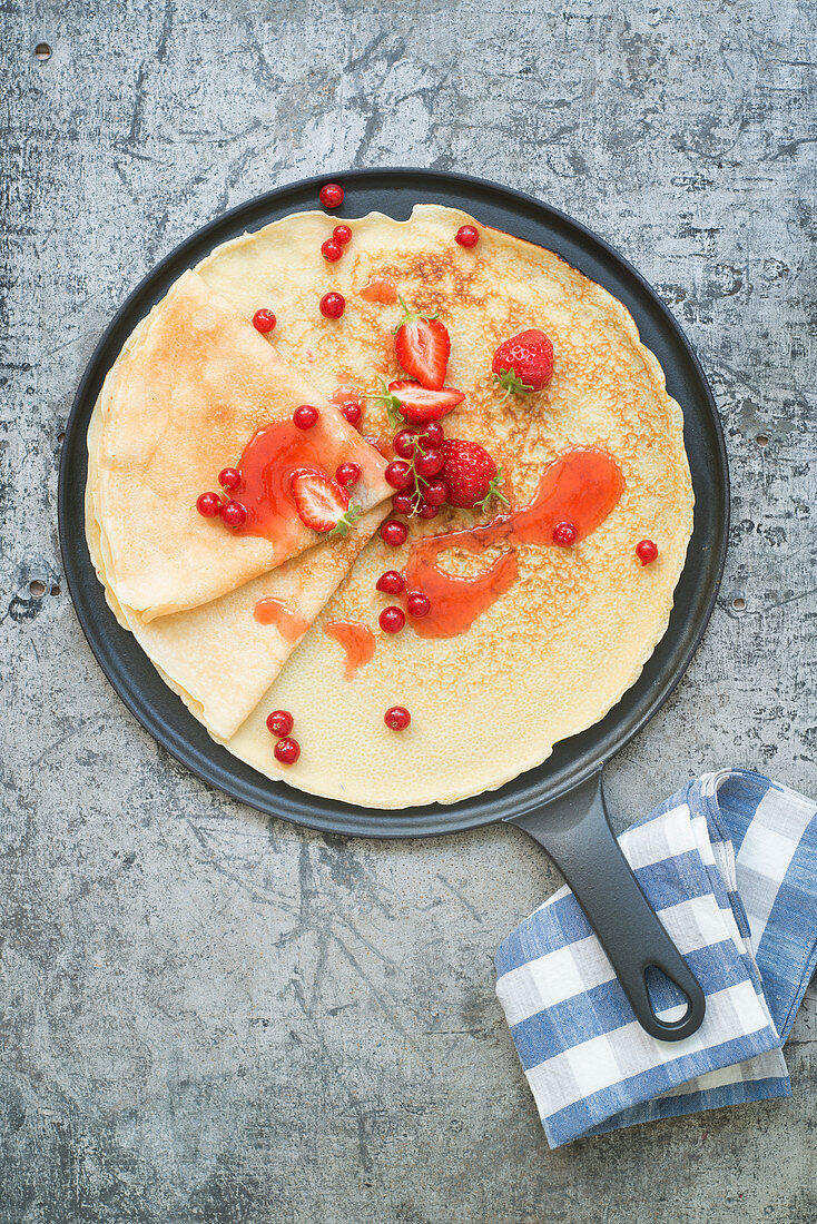 Crêpes with red fruit syrup