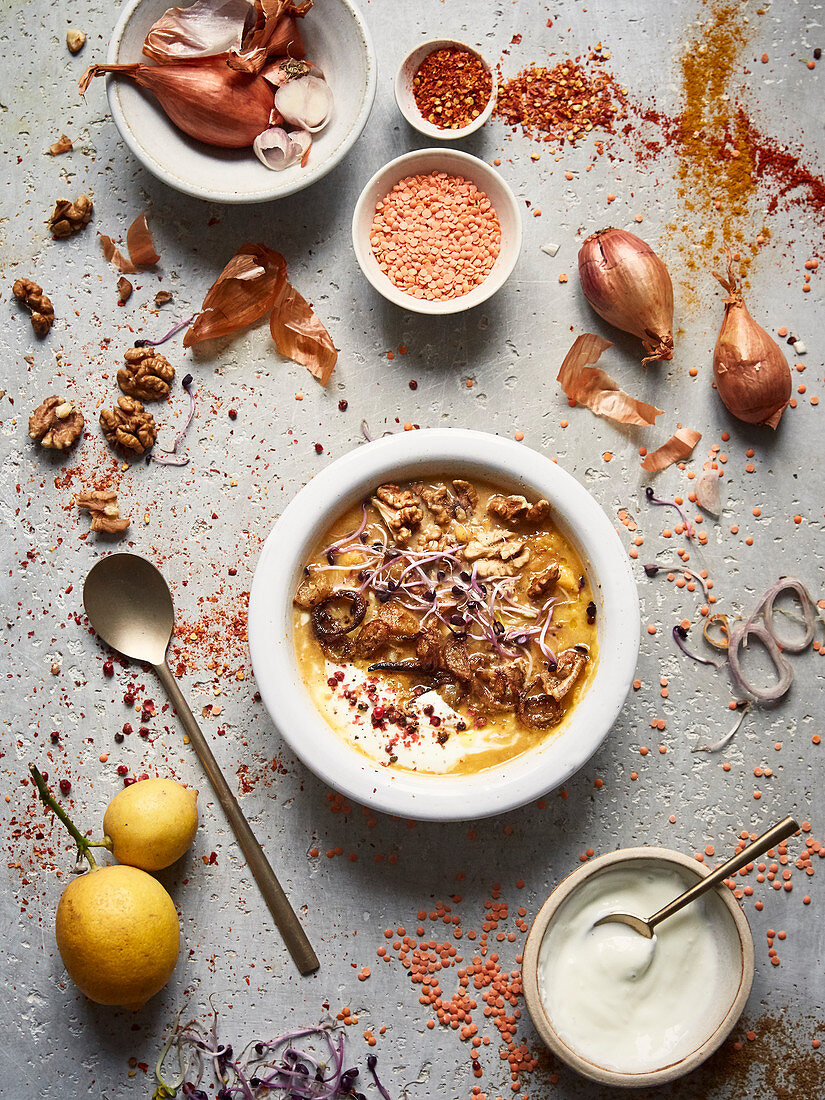 Orange lentil and sweet potato soup with walnuts and crisp shallots