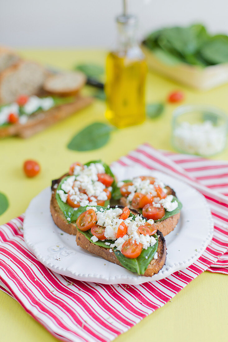 Baby spinach,feta and cherry tomato open-sandwiches
