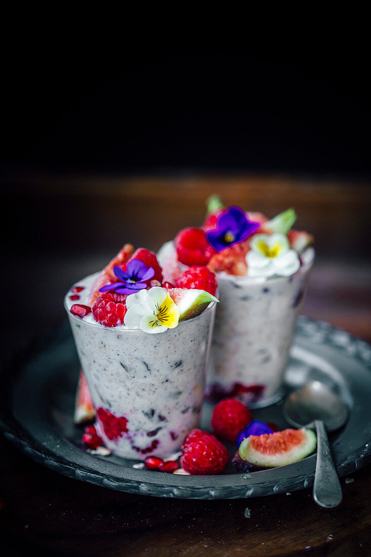 Chia seeds, figs and raspberries smoothie with flowers