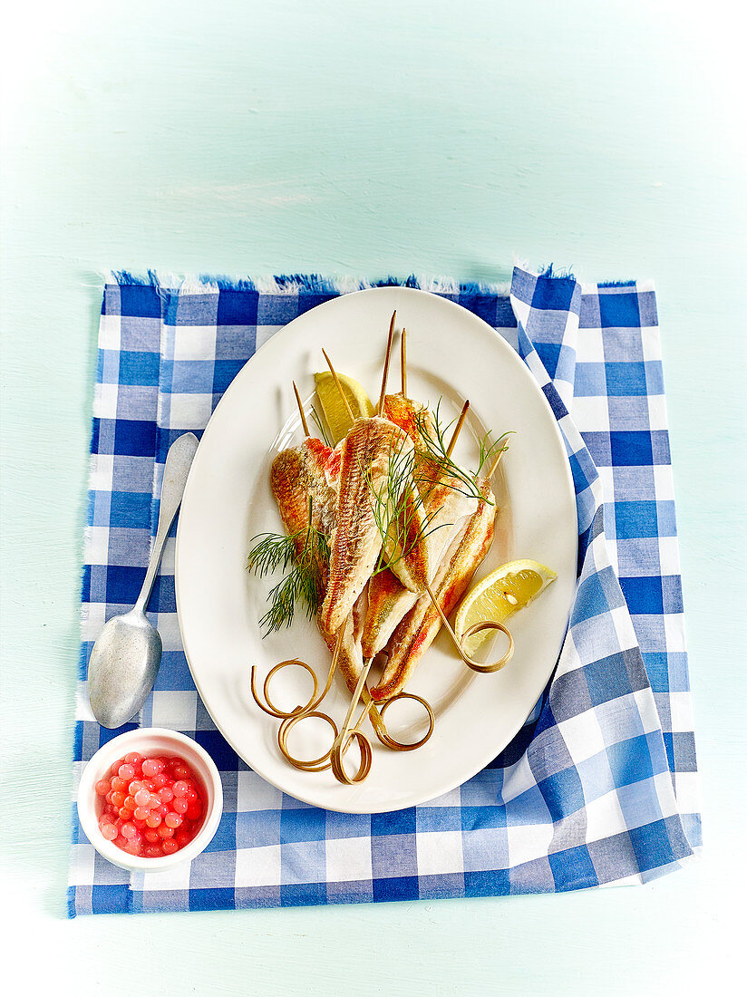 Red mullet skewers with lemon, dill and grapefruit pearls