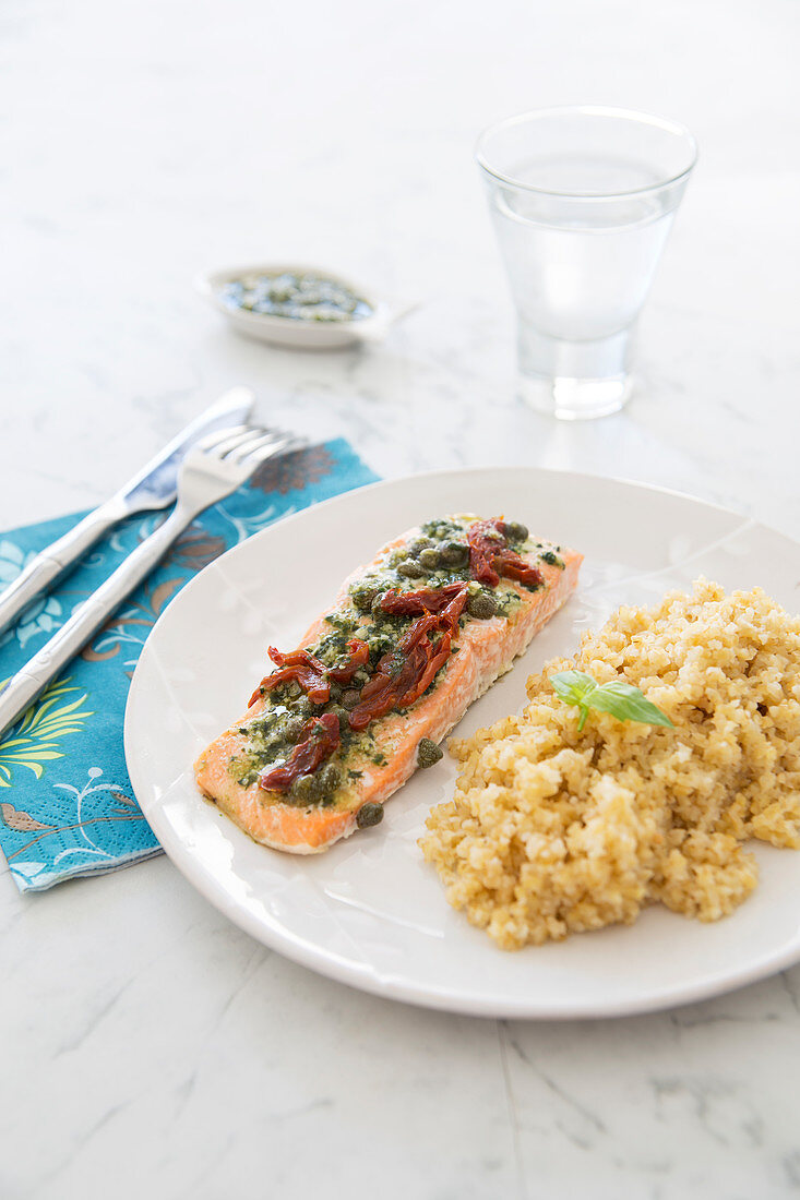 Piece Of Salmon Roasted With Pesto Sauce,Capers And Dried Tomatoes,Semolina