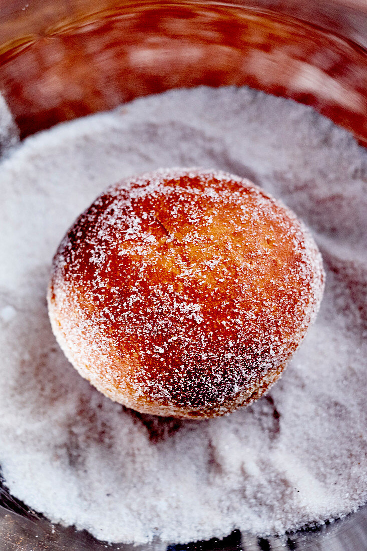 Once cooked ,fill the Berlin donut with jam and coat with castor sugar