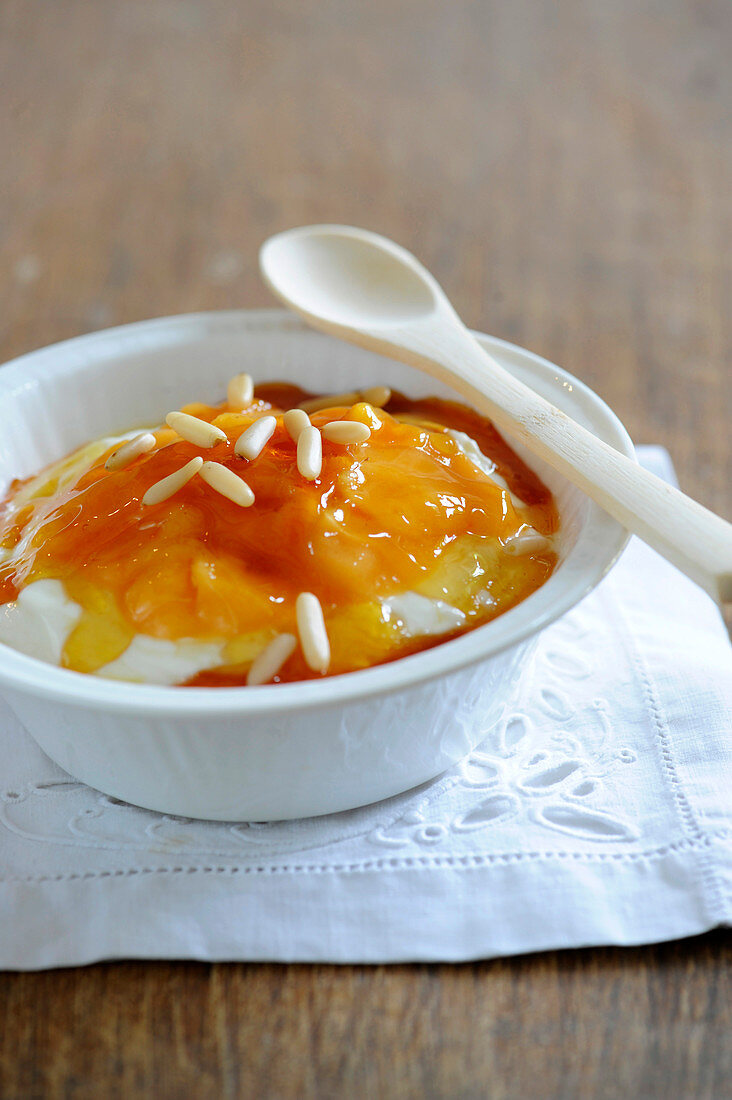 Faisselle with stewed peaches,express caramel and pine nuts