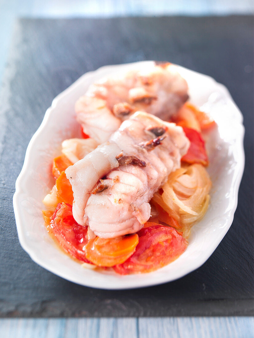 Monkfish with anchovies,tomatoes and onions