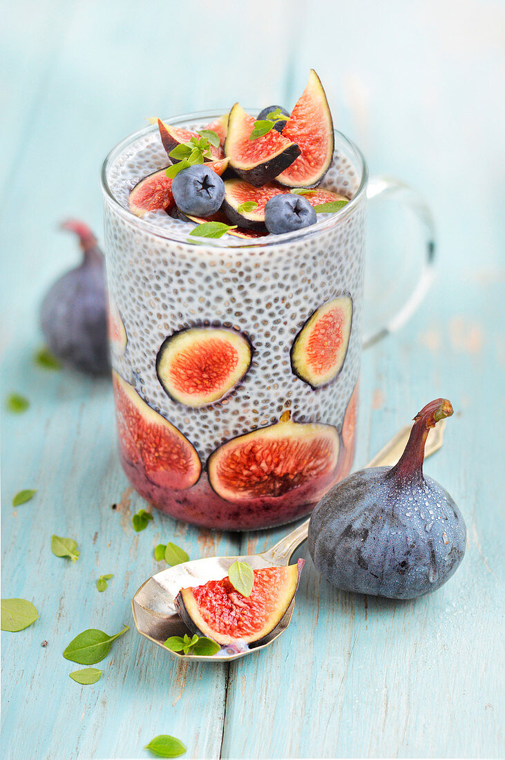Glass of chia seeds with figs and marjoram
