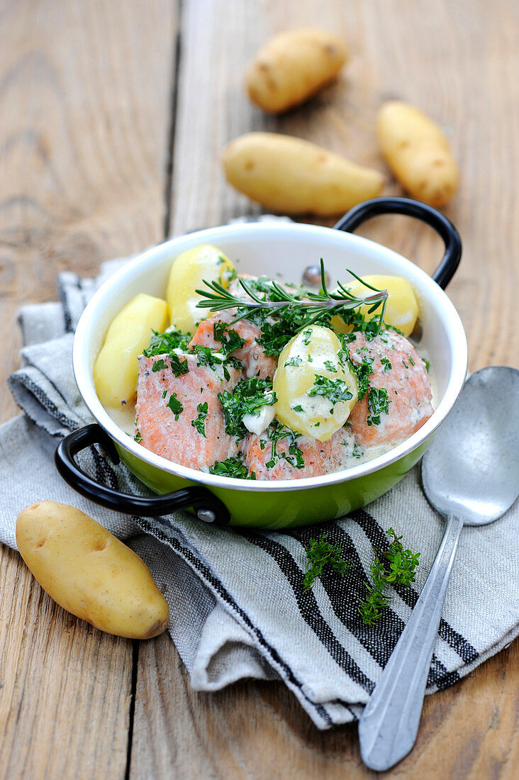 Salmon and potato casserole with herb cream