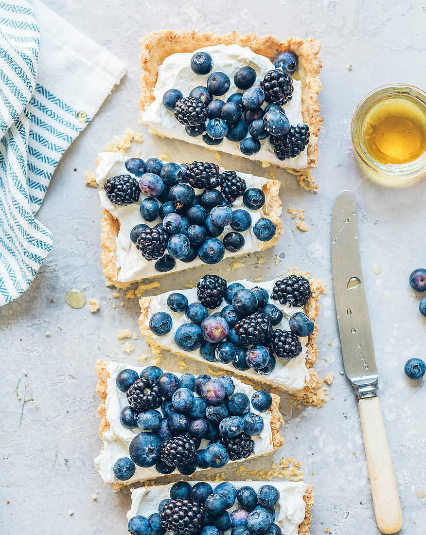 Cream cheese,blueberry,blackberry and honey rectangular tart