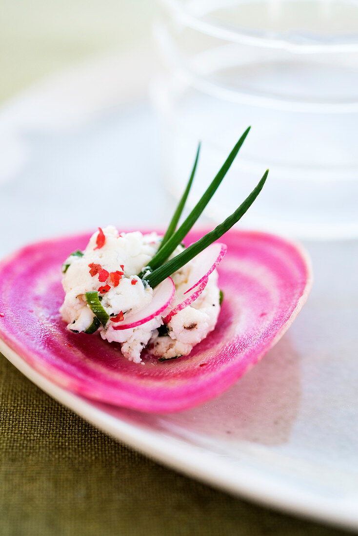 Chioggia beetroot,goat's cheese,chive and pink peppercorn canapé
