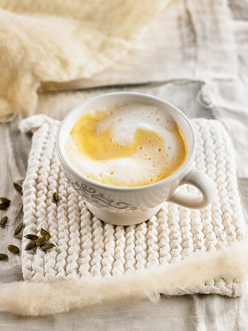 Cream of pumpkin soup with foamy milk topping
