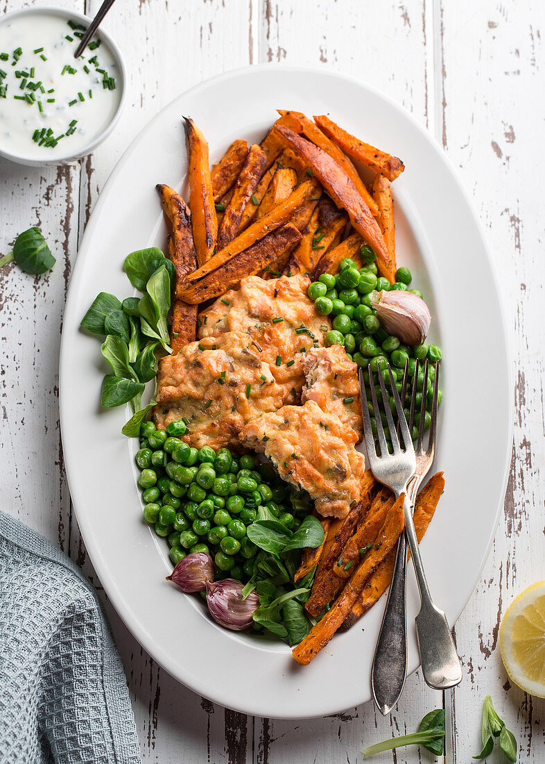 Fish cakes with peas and sweet potato fries