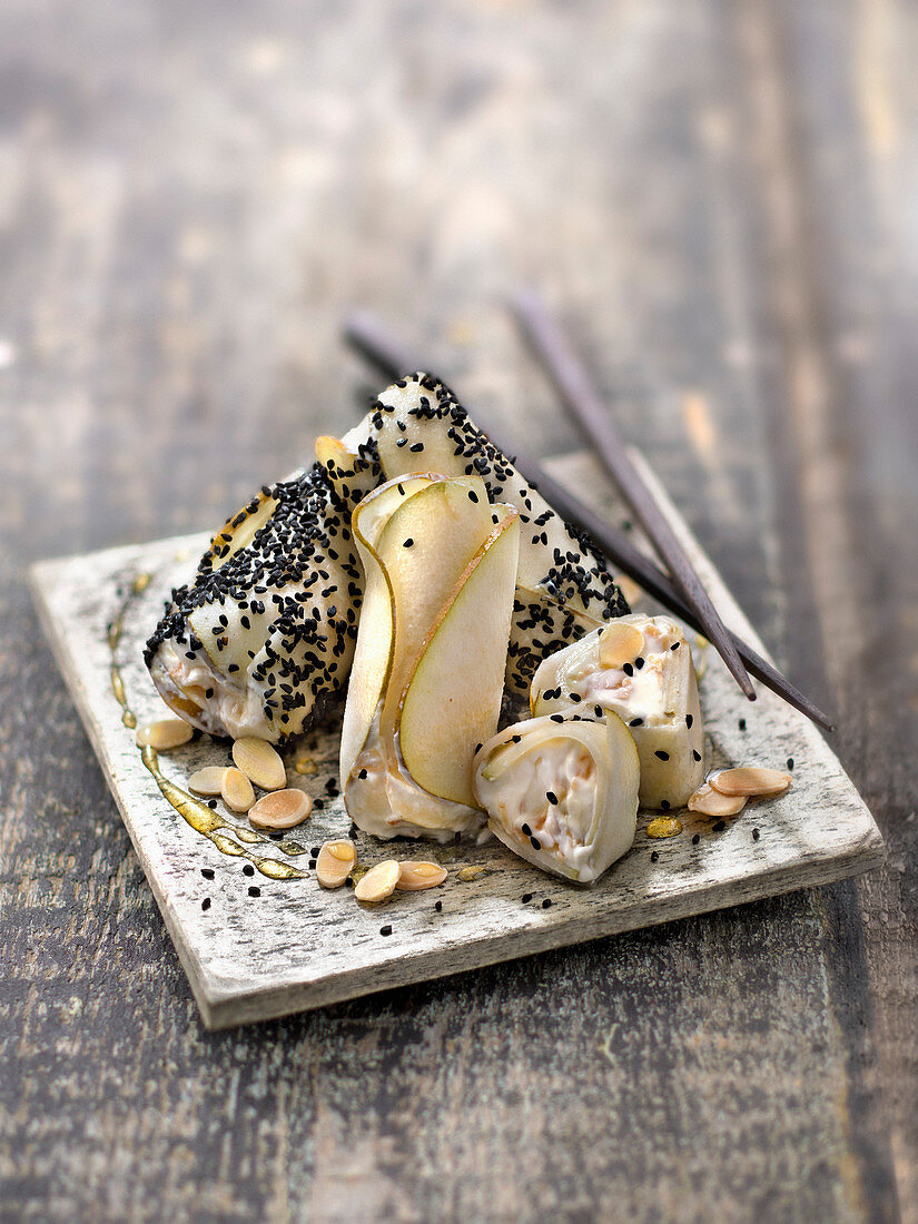 Pear ballottines with Saint-Morêt, honey and almonds in black sesame dress