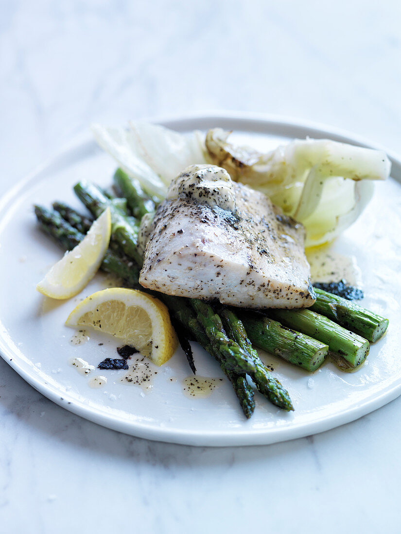 Roasted sea bass with kombu butter, iceberg lettuce and green asparagus