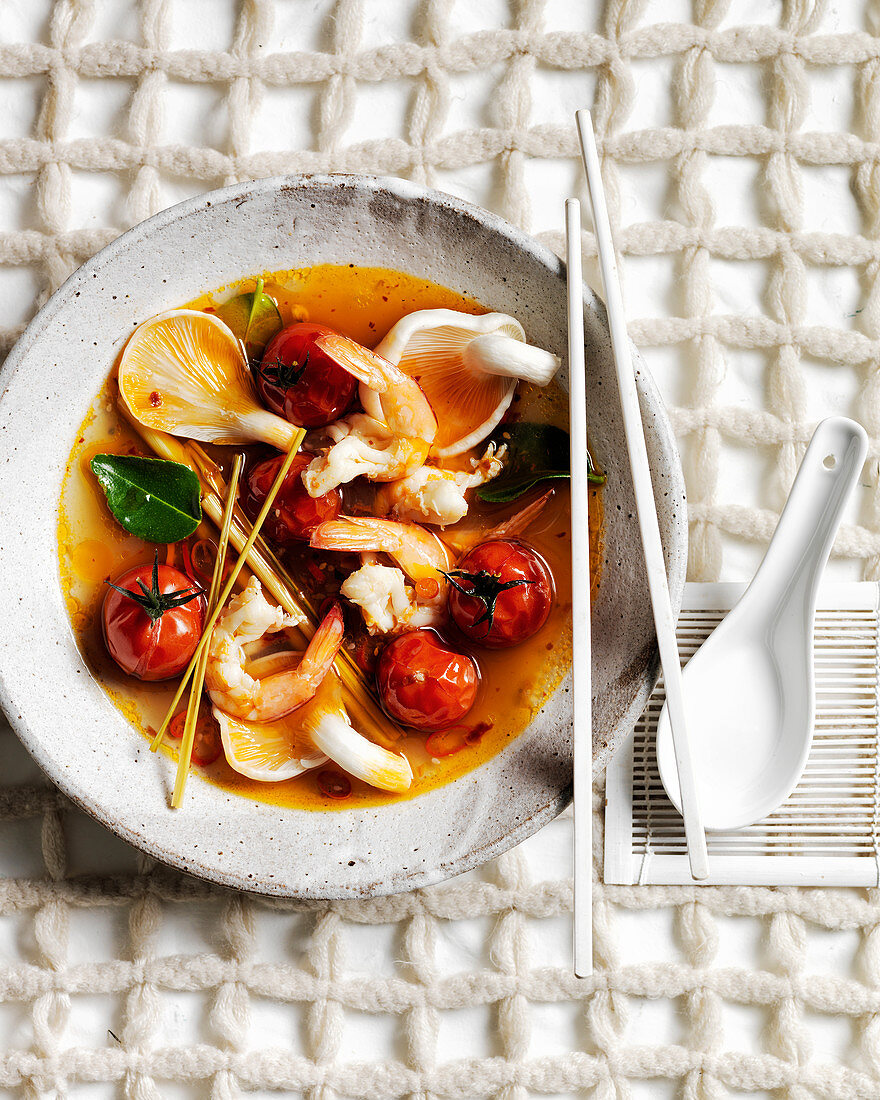 Tom yum, Thai shrimp, mushroom and cherry tomato soup with lemon grass and combava leaves