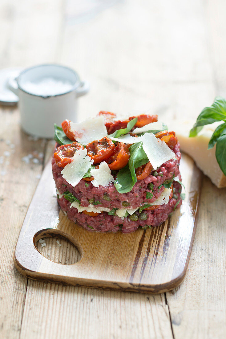 Beef tartare with confit tomato, parmesan and basil
