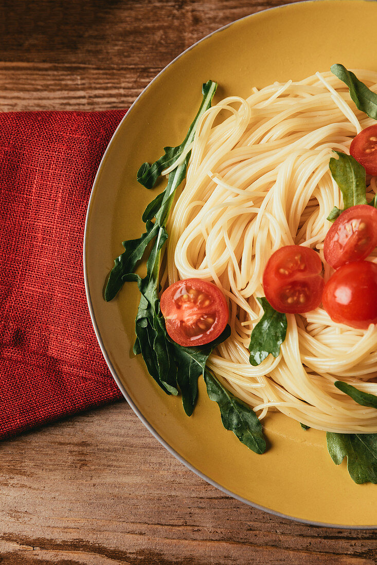 Pasta with tomatoes and rocket (Italy)