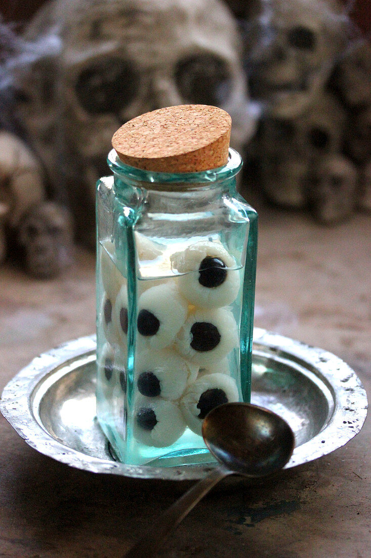 Syrup eye jar with lychees and black grapes