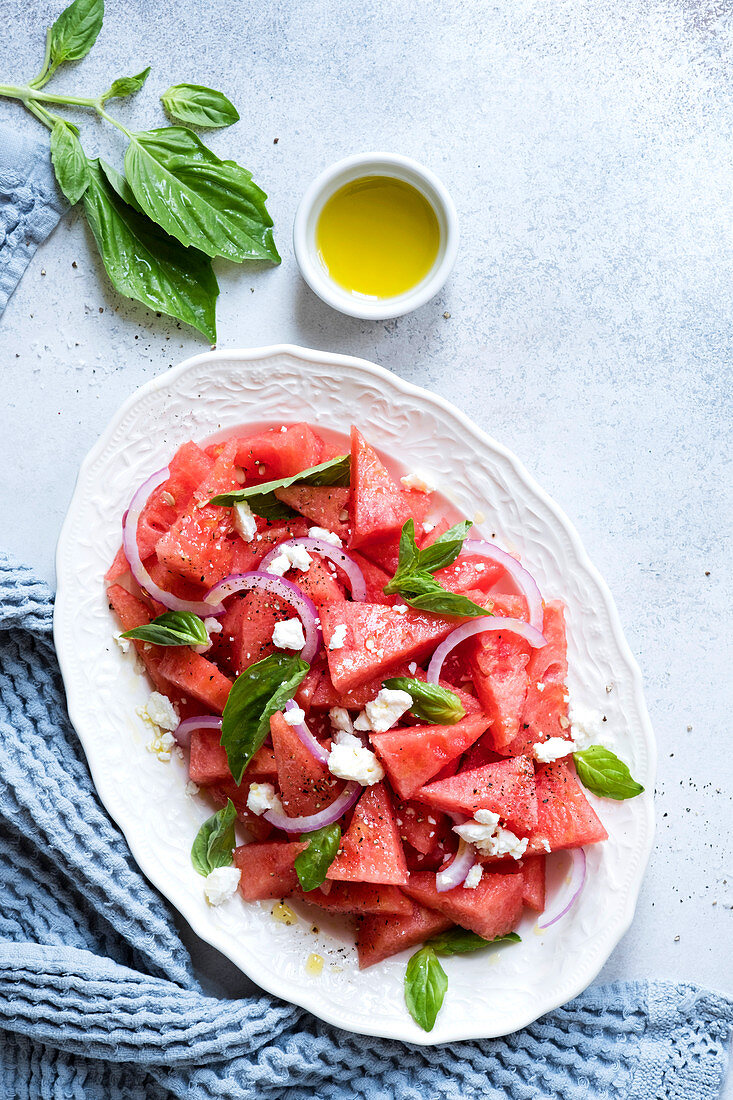 Watermelon and feta salad, with basil, red onion, and olive oil