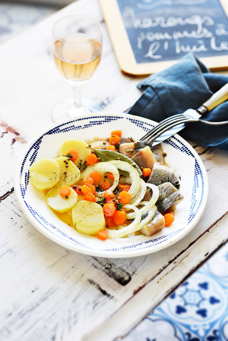 Herrings with potato salad in oil dressing