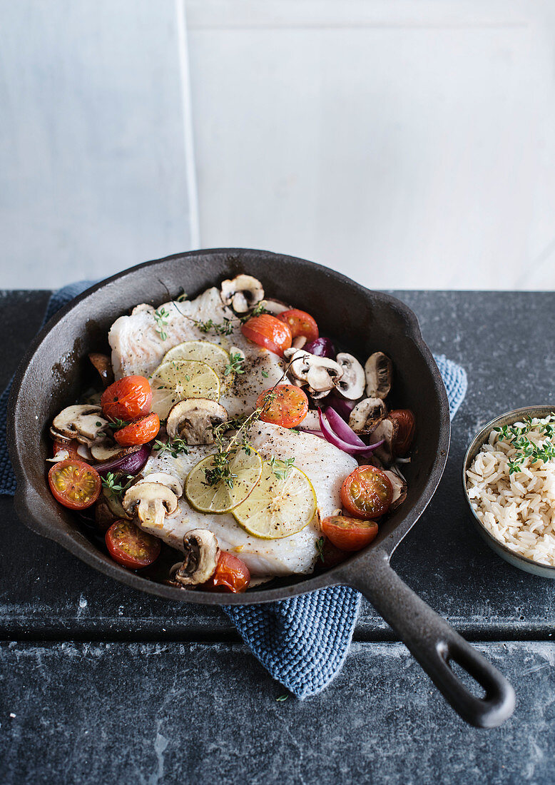 Pan fried fish with mushrooms, onions and cherry tomatoes