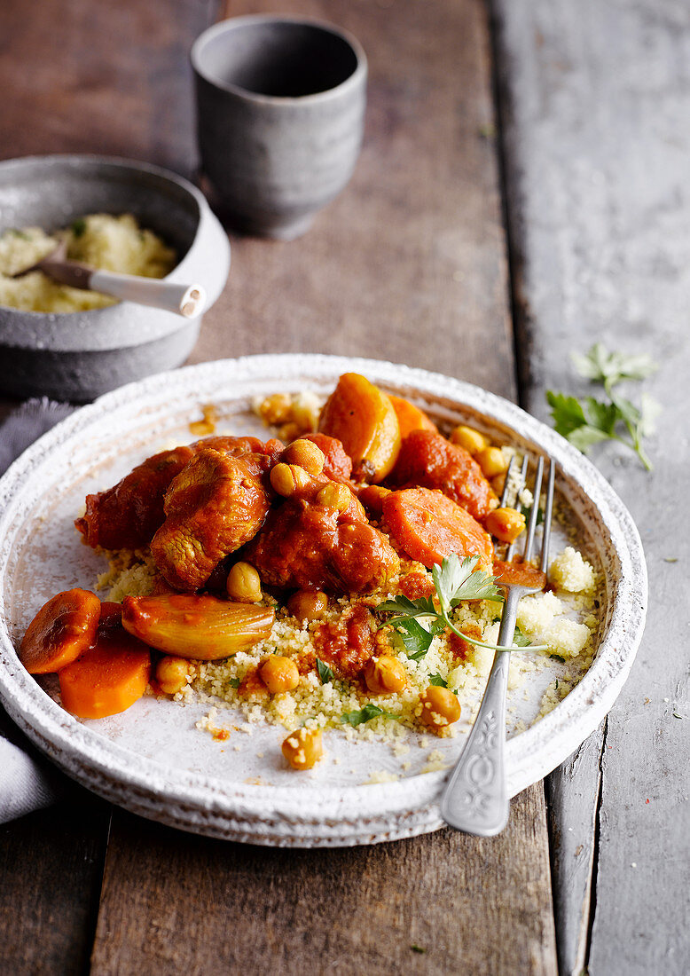 Meat tagine with chickpeas, carrots and couscous