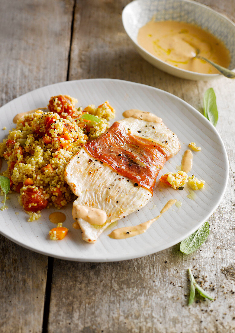 Chicken escalope saltimbocca with couscous and cherry tomatoes