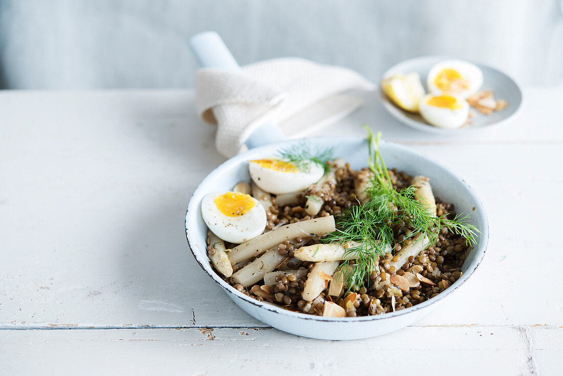 Lentil risotto with white asparagus and waxy egg