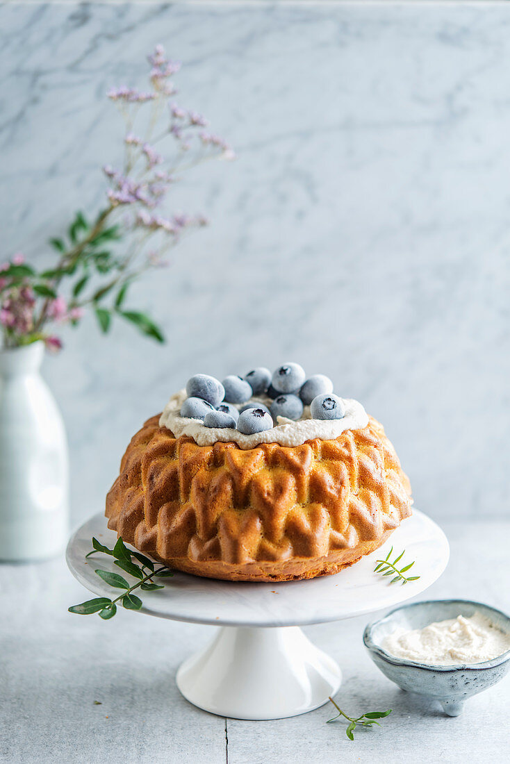 Carrot cake with cashew cream and blueberries