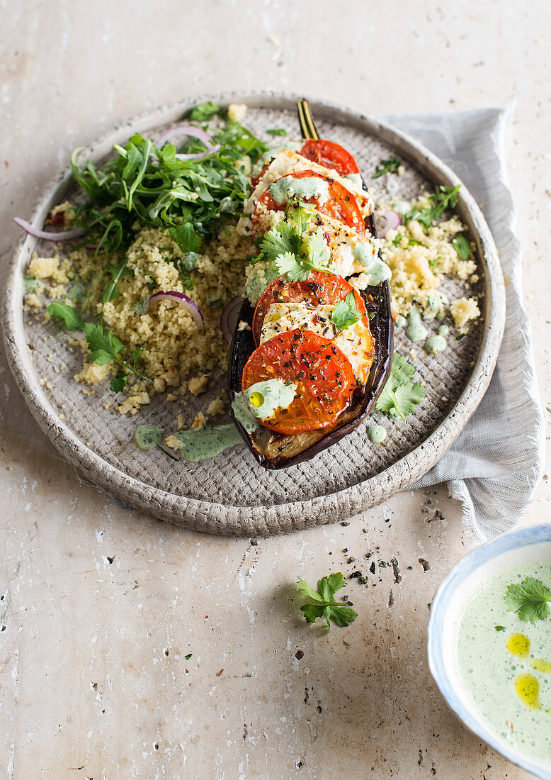 Couscous with herbs and baked aubergine with tomato-feta filling