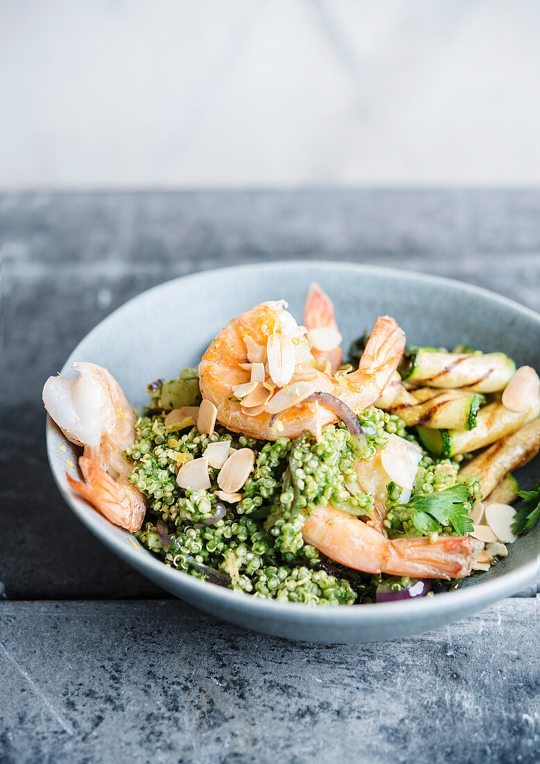 Scampi with green quinoa, courgette and almond flakes