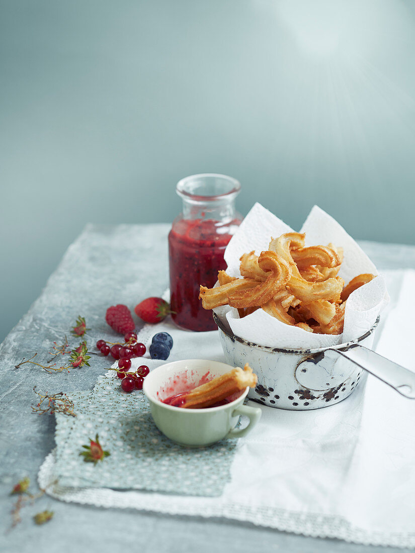 Churros with red fruit coulis