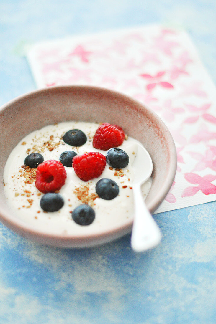 Bowl Of Fromage Blanc With Summer Berries And Crushed Almonds