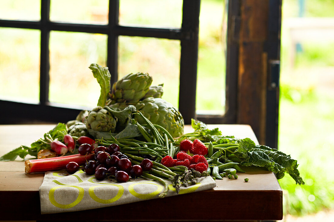 Still life with spring vegetables and fruit