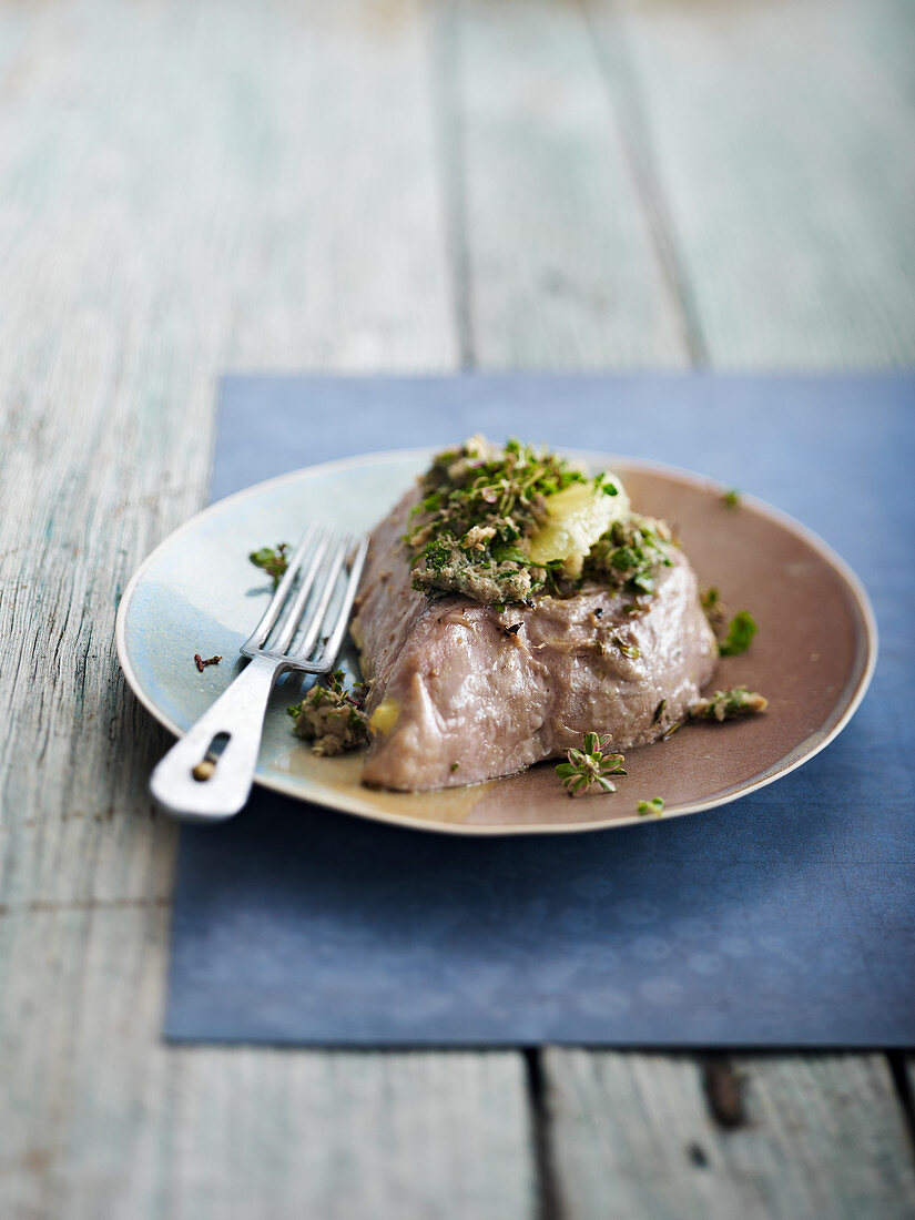 Grilled tuna steak with herbs
